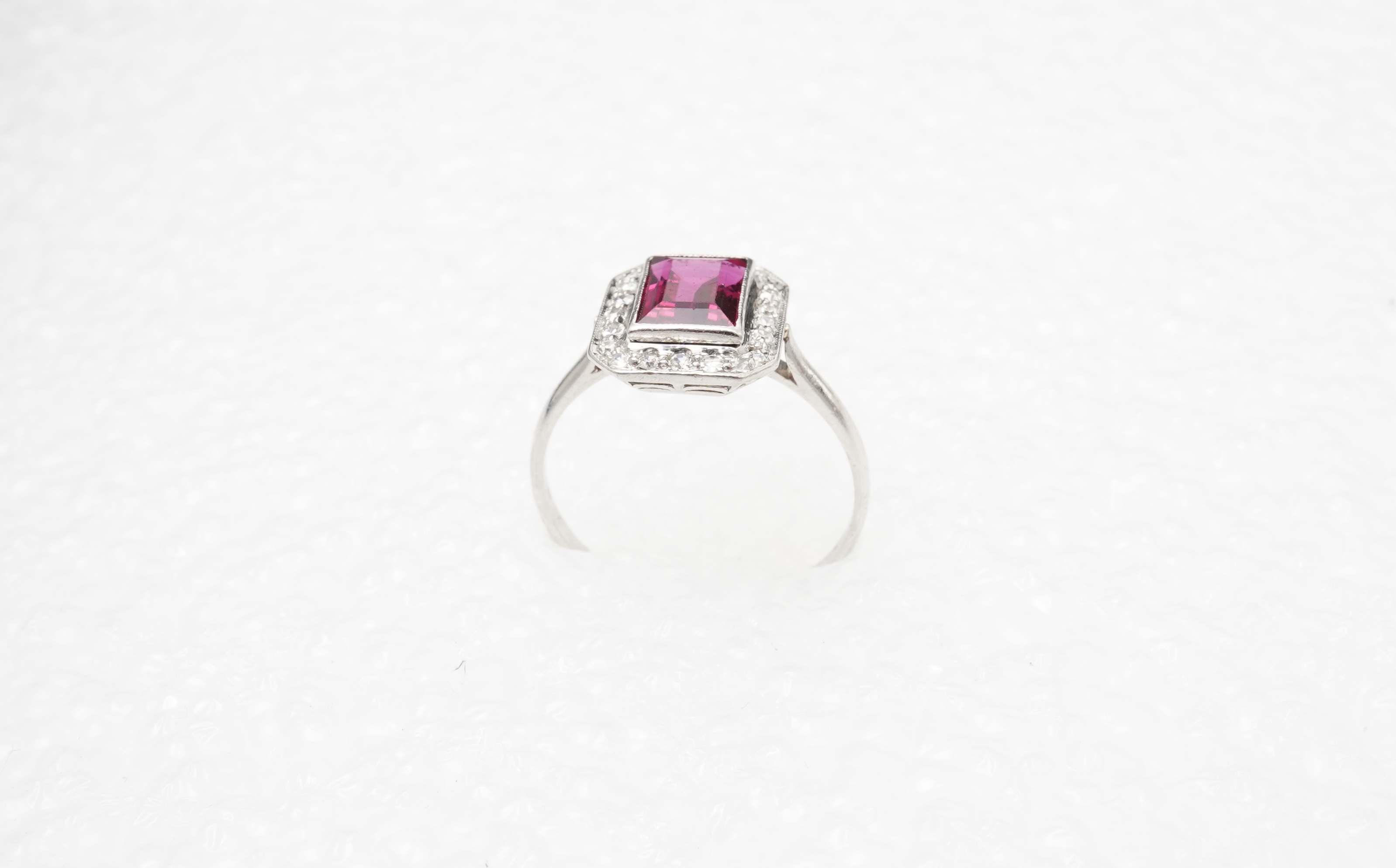 A synthetic ruby and diamond cluster ring, early 20th century